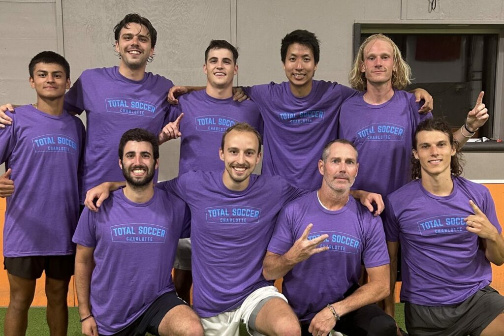 Adult division team poses in their league shirts! Be sure to keep up with your league schedule and standings!